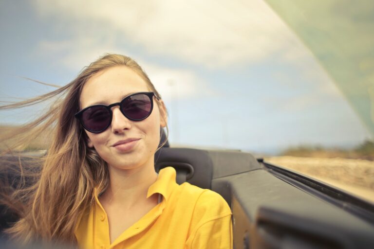 Woman in a car smiling